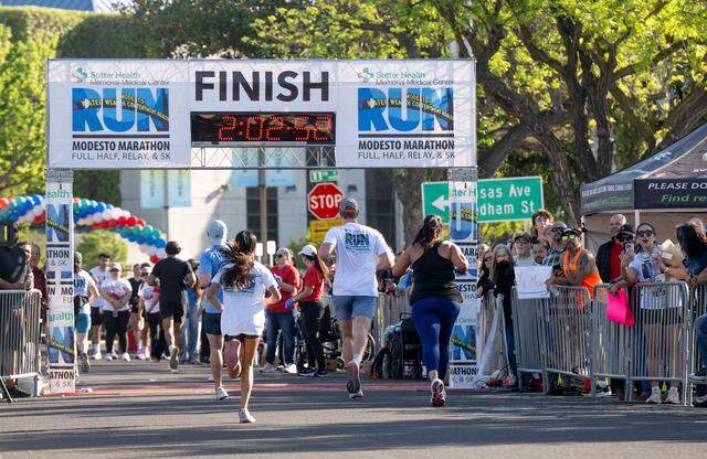 Racers cross the finish line.